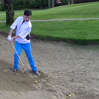 How to Hit a Bunker Shot With an Uphill Lie